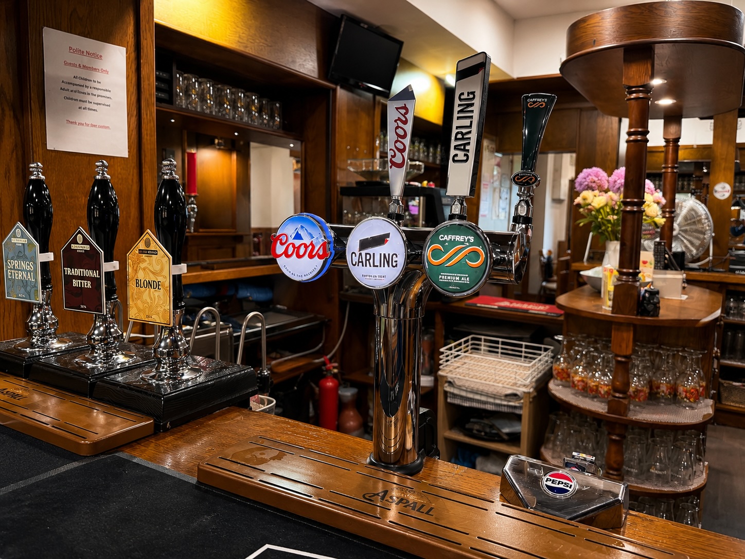Real ale handpumps at The Crown and Anchor — Springs Eternal, Traditional Bitter, Blonde, Coors, Carling and Caffrey's